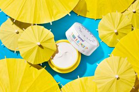 supergoop triple prep surrounded by yellow umbrellas