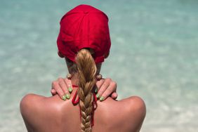 baseball-cap-hairstyles-realsimple-GettyImages-637584234