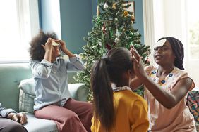 christmas-games: family playing a Christmas game together