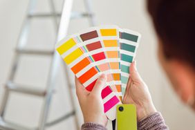 A woman choosing paint colors