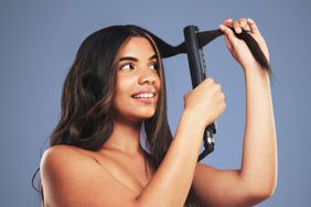 curl-hair-with-flat-iron-GettyImages-1781794761