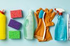 Cleaning concept. Set of cleaning supplies on blue background, top view