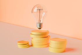 light bulb above coins