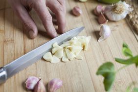 Homemade food - preparation in the kichen, galic sliced for marinate.