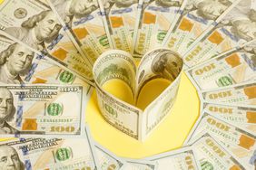 Dollar US bills in heart shape