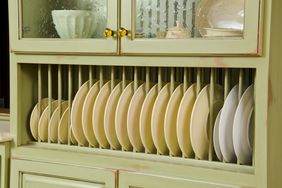 This modern kitchen gives a close up of the cabinet with dishes.