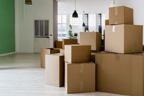 Carboard boxes in living room of new house