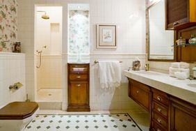 bathroom with dark wood cabinets