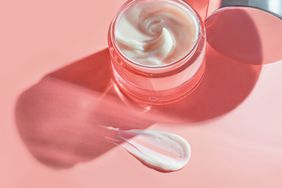 Refreshing Hydration Water Cream or Hand Cream on natural pastel pink colour background. Smudged makeup emulsion cream smear, Hair Mask and Skincare Moisturizer smudge, cosmetics product and paint strokes. Various natural Smears of cream, gel and serum