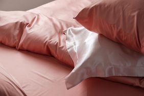 Closeup view of bed with beautiful silk linens