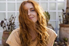 woman with red wavy long hair