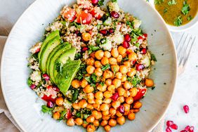 Quinoa chickpea salad with tomato, cucumber, pomegranate and avocado